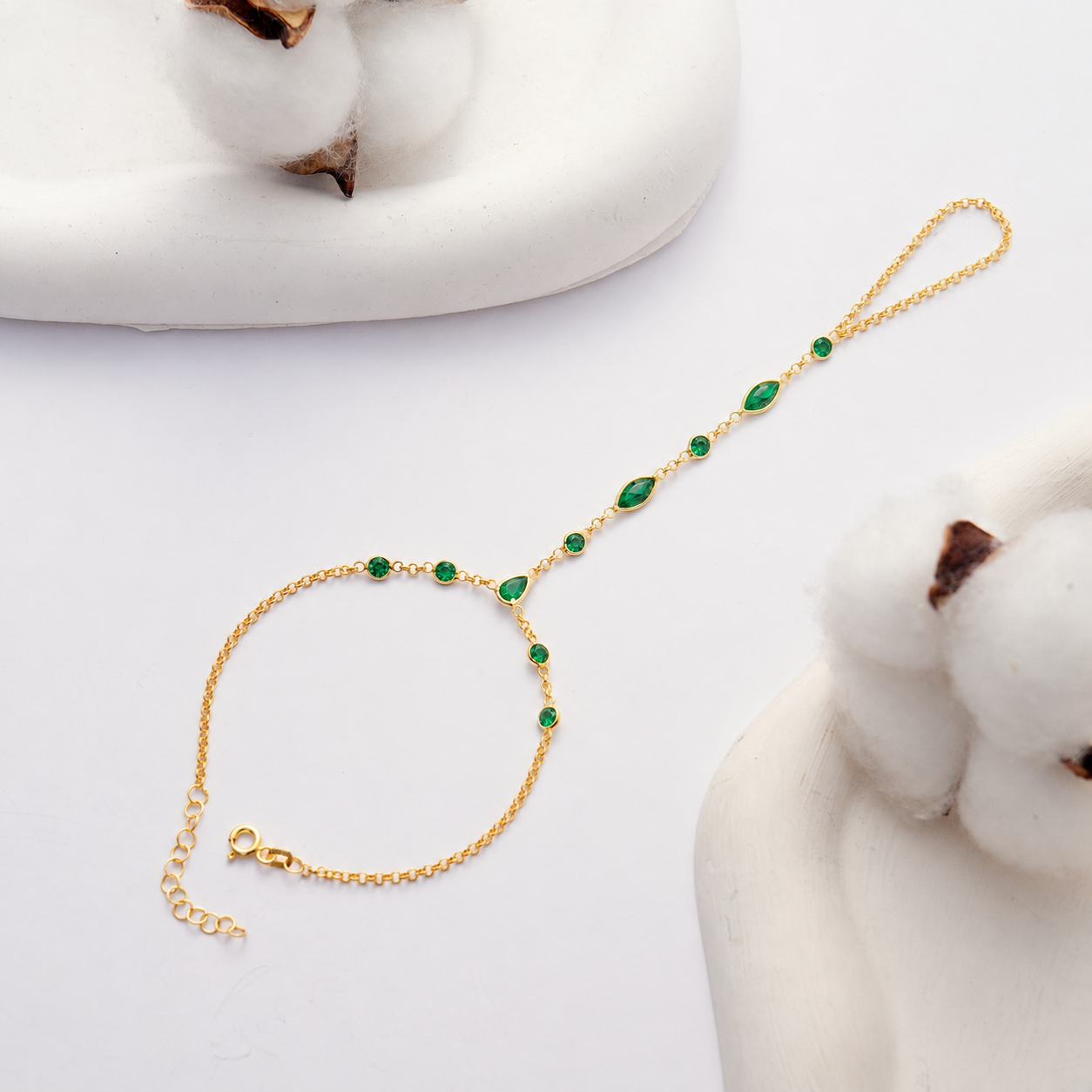 14K Gold Plated Hand Chain Bracelet with Emerald Green Cubic Zirconia on White Background