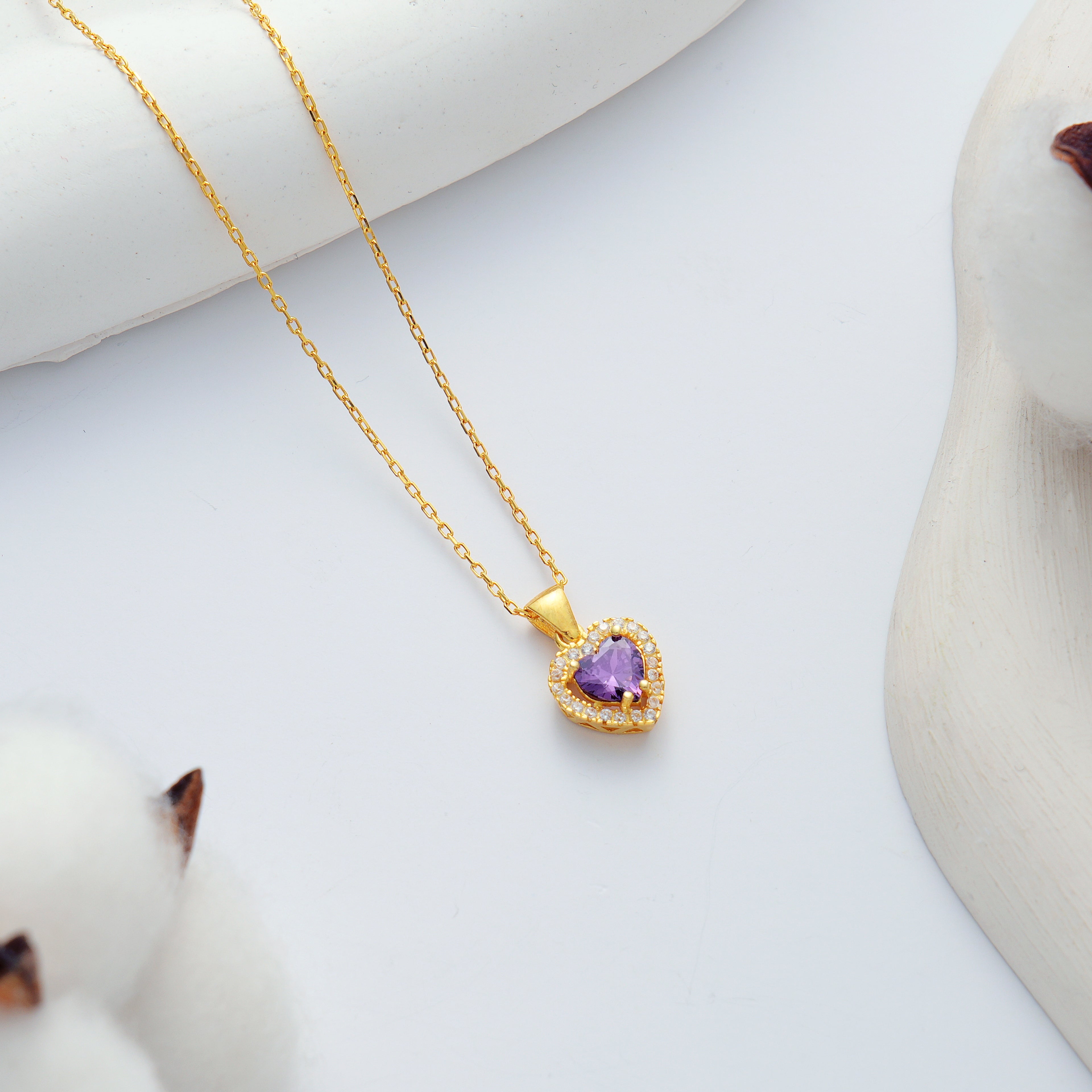 14K gold plated 925 sterling silver heart necklace with an amethyst color heart-shaped cubic zirconia and sparkling clear CZ halo.