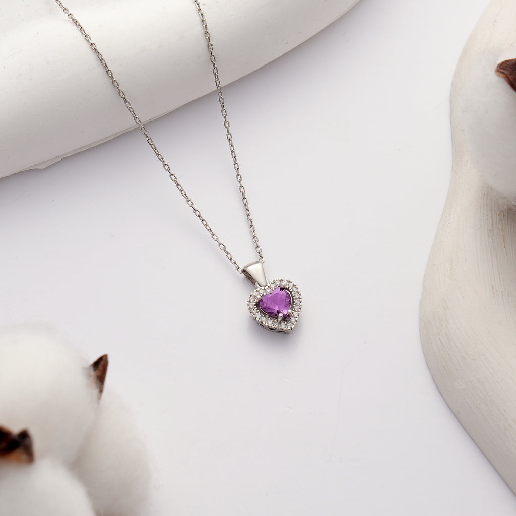 925 sterling silver heart pendant necklace featuring an amethyst color heart-shaped cubic zirconia and brilliant clear CZ halo.