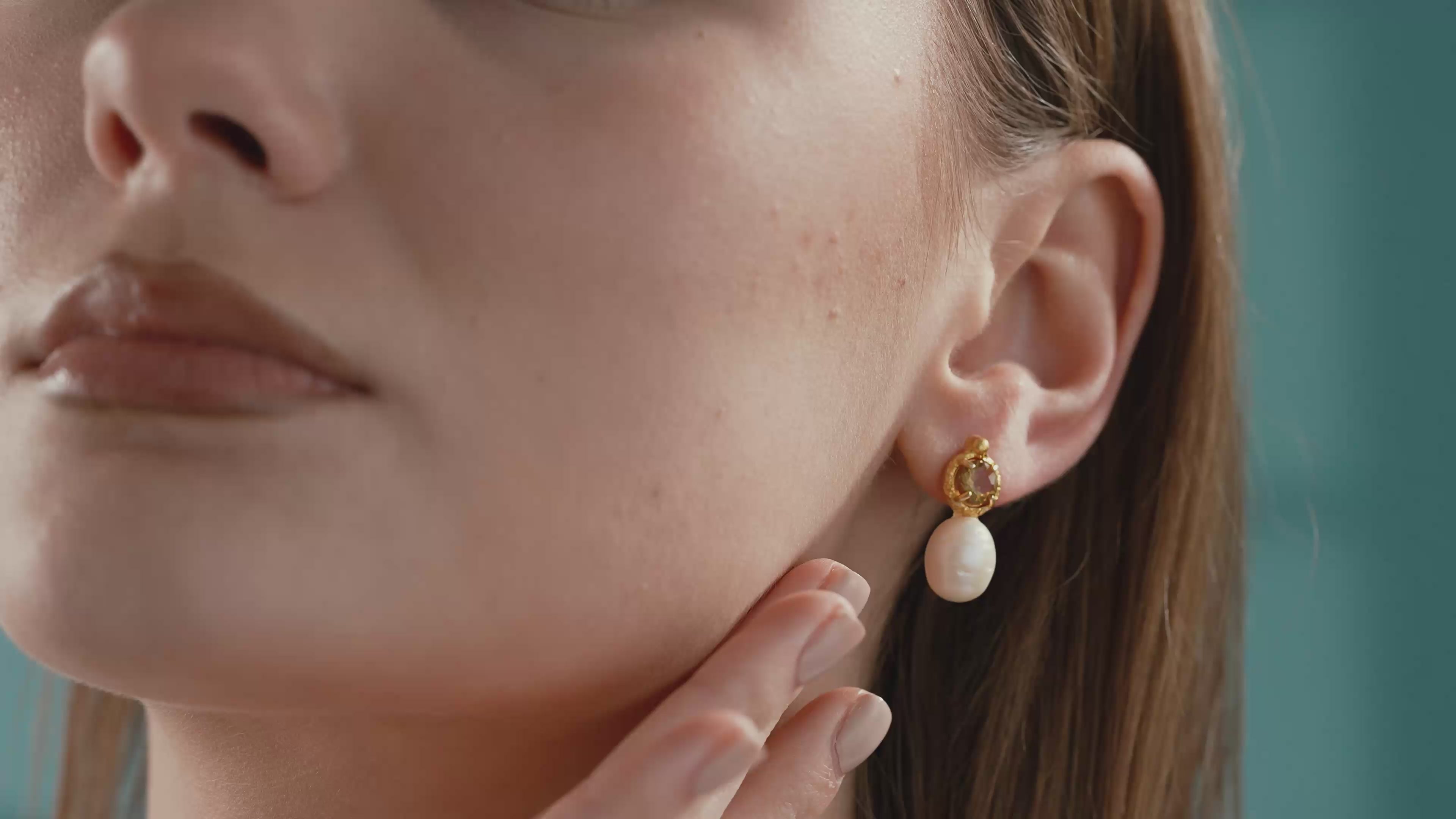 Video of Minimalist 14K gold plated sterling silver earrings with round natural diaspore gemstones and oval freshwater pearl drop design.